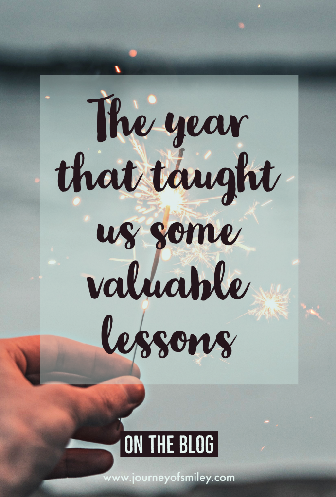 The year that taught us some valuable lessons Journeyofsmiley blog post a hand holding a shiny sparkle for New Year 