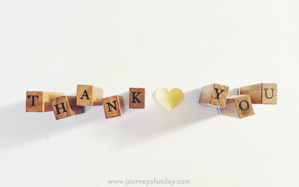 A white background and on it cubes with letters Thank you and a heart cut paper in the middle on Journeyofsmiley blog