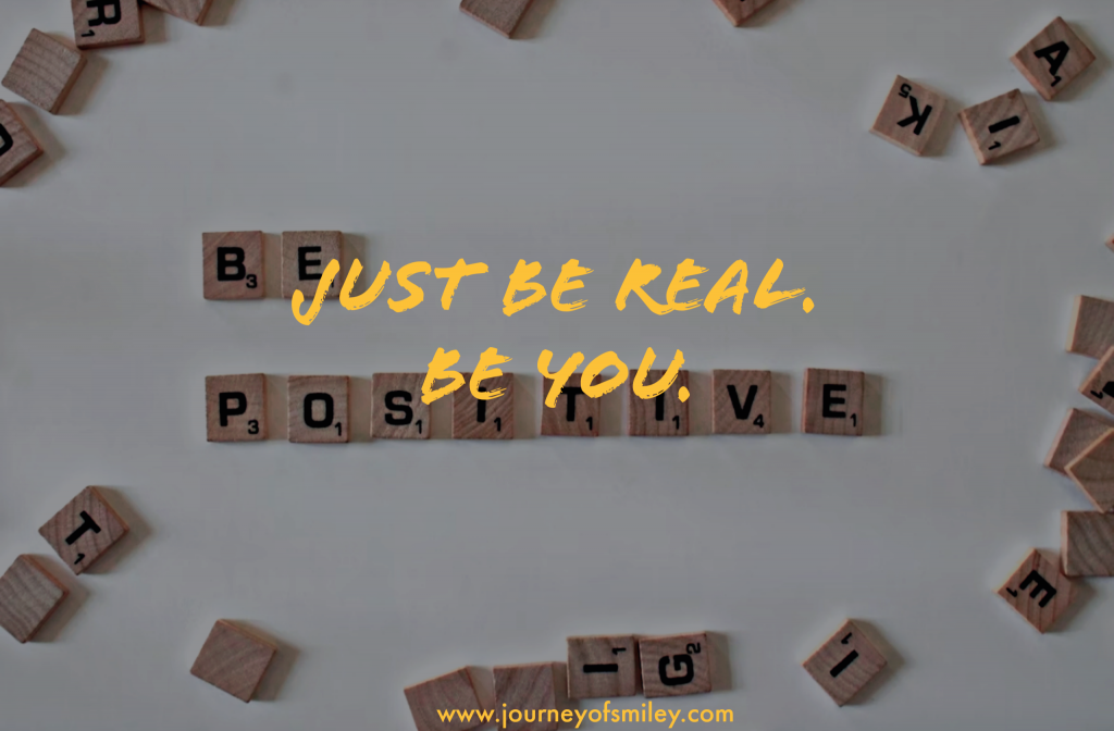 a sign made of letters saying 'be positive' and over it a sign saying 'just be real, be yourself' on Journeyofsmiley blog