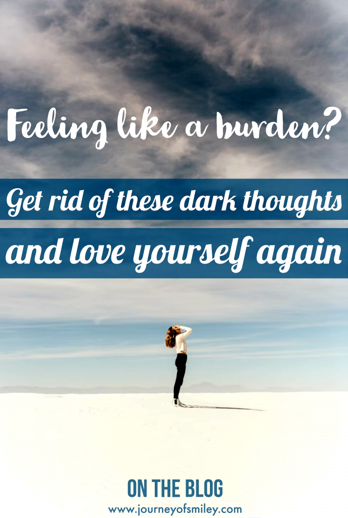 A woman standing on a beach and covering her face with her hands, looking up to dark clouds and title 'Feeling like a burden?' Get rid of these dark thoughts on Journeyofsmiley blog