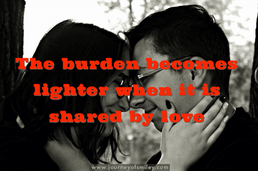a couple holding each other's heads, hugging each other in black and white photo and red coloured letters quote the burden becomes lighter when it is shared by love, photo by Sarah Kover, on www.journeyofsmiley.com