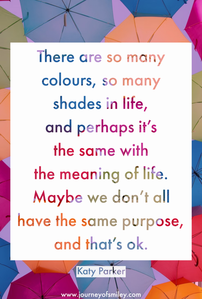 Many colourful umbrellas in the air and over it is an inspirational quote about many colours, many shades in life and different meaning of life of each individual by Katy Parker on Journeyofsmiley blog