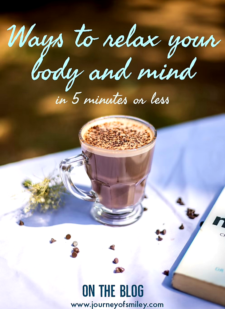 Coffee on a table with a book and the title is Ways to relax your body and mind in 5 minutes or less on the Journeyofsmiley blog