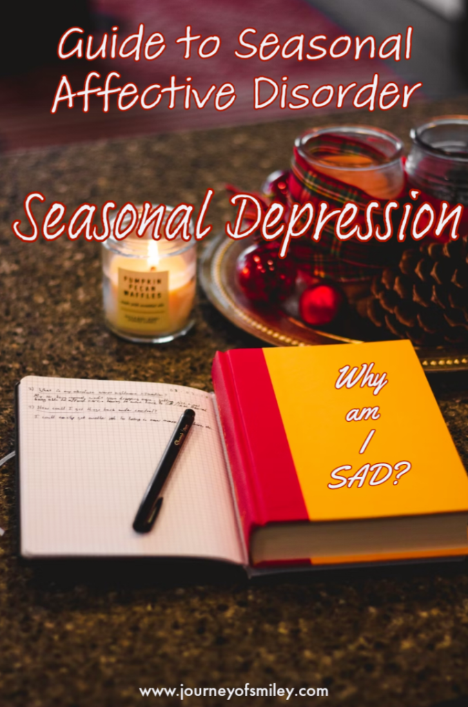 counter with seasonal decorations, a candle, an open worksheet and a closed book with the title Why am I SAD? and the title is Guide to seasonal affective disorder Seasonal Depression on the journeyofsmiley blog
