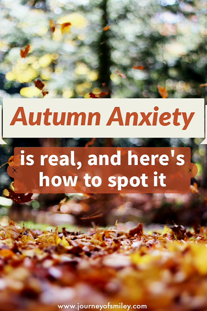 Picture of a tree and autumn colours leaves on the ground and in the air and the title is Autumn Anxiety on the Journeyofsmiley blog