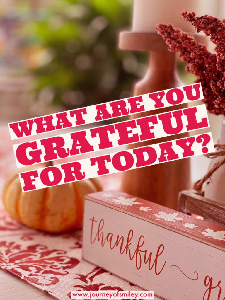 a table with a candle on top of it and a pumpkin and the title is What are you grateful for today? on Journeyofsmiley blog