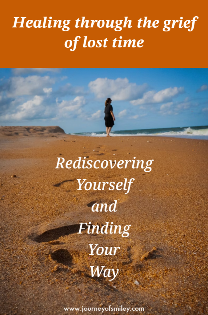 A woman standing on the sand on the beach by the sea and below her is the writing, 'Rediscovering Yourself and Finding Your Way' and above is the title, 'Healing through the grief of lost time' on Journeyofsmiley