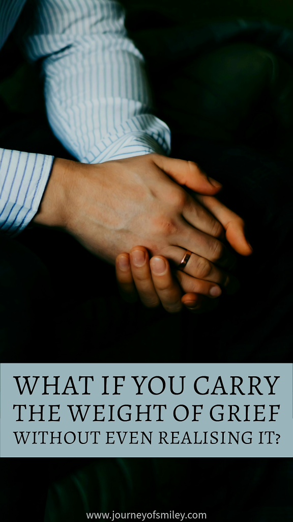 Male hands put together and below is the title What if you carry the weight of grief without even realising it? on Journeyofsmiley.com
