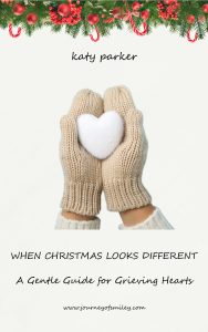 A Gentle Guide for Grieving Hearts WHEN CHRISTMAS LOOKS DIFFERENT Two hands holding a while snow heart