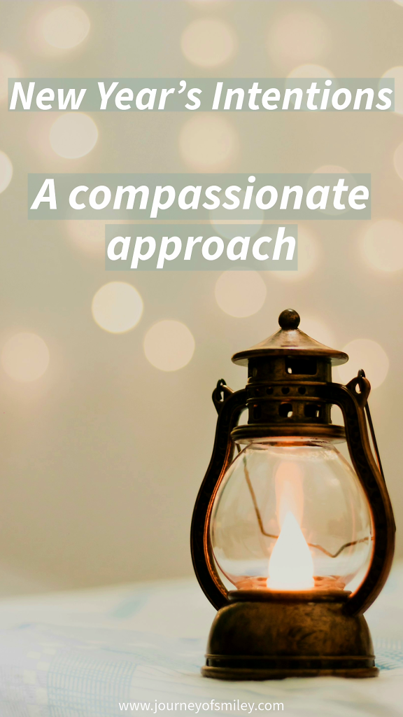 A lantern with a candle on, and little sparkly lights around it and the title New Year's Intentions: A compassionate approach, on Journeyofsmiley blog