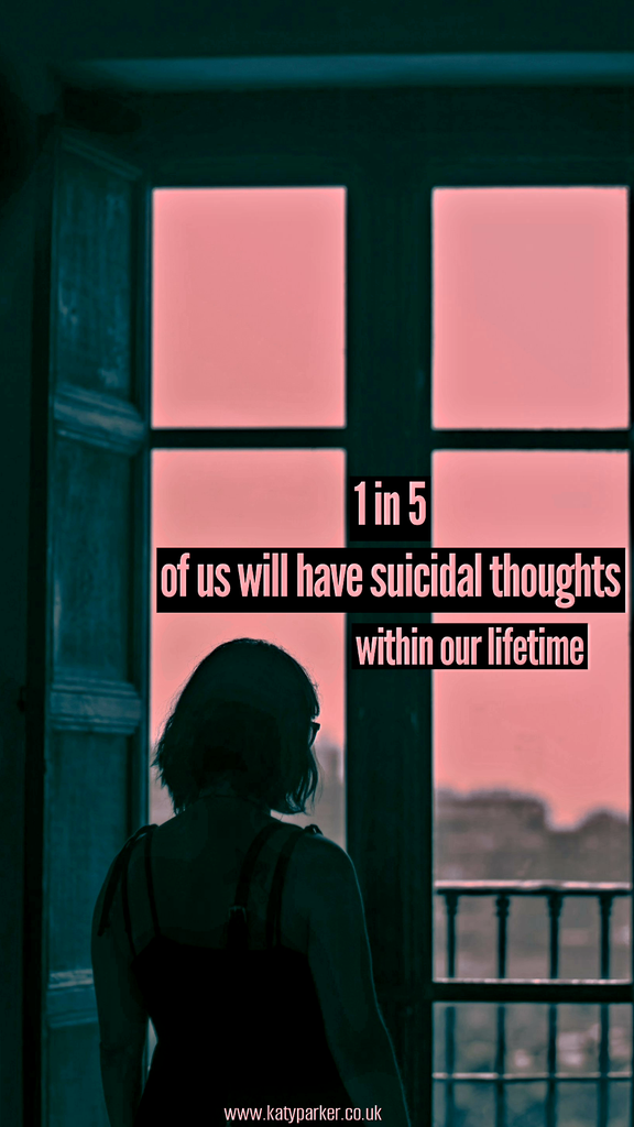 A woman standing by a big window looking out, outside is a pink sky and grey buildings in the background and on the window is written 1 in 5 of us will have suicidal thoughts within out lifetime on katyparker.co.uk
