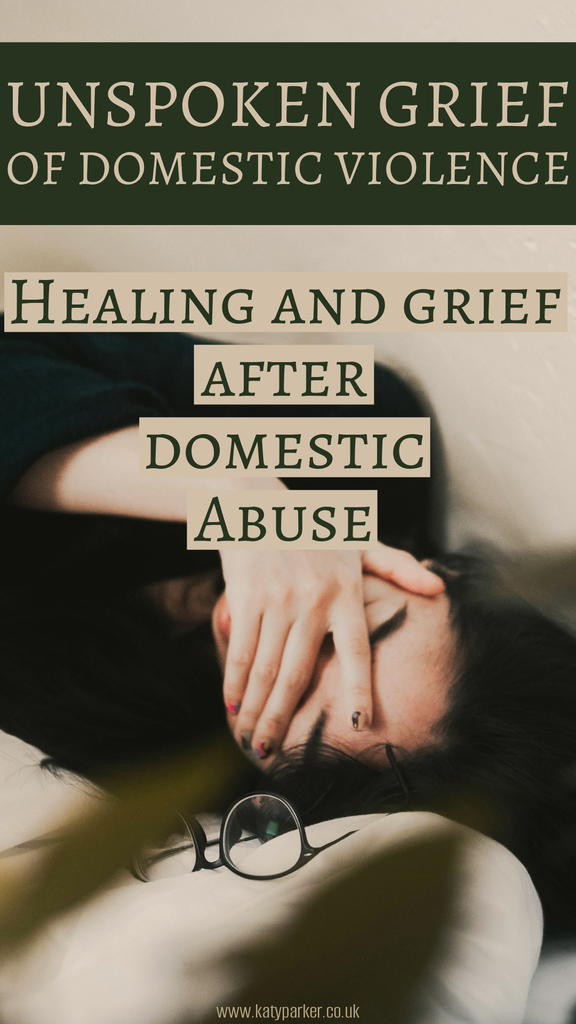 A women in black jumper laying on the bed, covering her face, glasses next to her, and the title is Unspoken grief of domestic violence: Healing and Grief after domestic abuse by Katy Parker